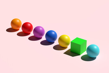 One cube stands in the row of colorful spheres. Conceptual image of individuality, difference and standing out from the crowd.