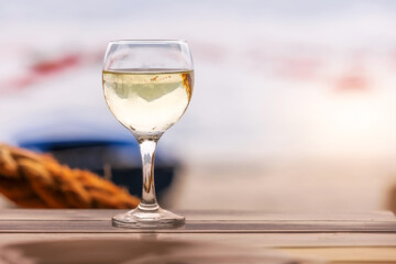 Glasse of white wine on wooden table
