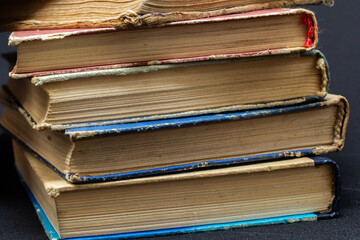 Book background. Stack of books in the library. Old yellow pages of paper books. Learning and knowledge