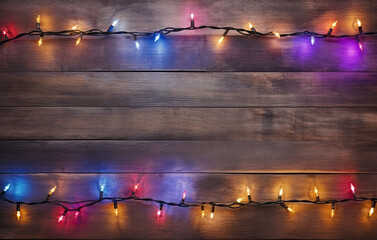 Christmas Light on Wooden Background Top View with Copyspace. Garland Lights on Vintage Wood Texture