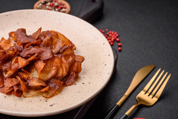 Delicious crispy potato chips with salt and spices