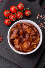 Delicious crispy potato chips with salt and spices
