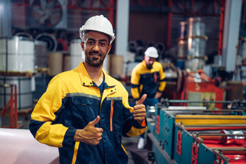 Portrait of Smiling Professional Industry Engineer standing and looking camera, Worker Wearing Safety Uniform and Hard Hat at factory. Machine maintenance technician operation concept.