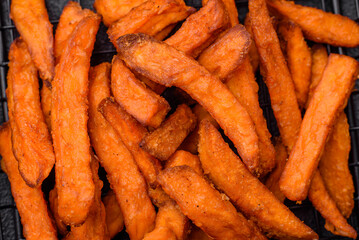 Delicious crispy sweet potato fries with salt, spices and herbs