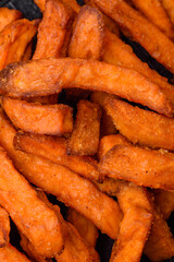 Delicious crispy sweet potato fries with salt, spices and herbs