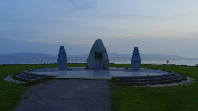 Pull out shot of Celia Griffin Memorial Park - Irish heritage with beautiful panorama of Galway Bay. Ireland