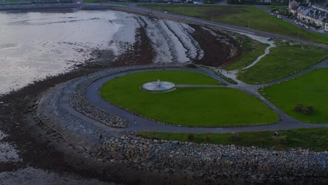 Overhead view Celia Griffin Memorial Park, cinematic aerial orbit. Galway, Ireland