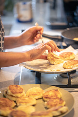 The process of making cheesecakes, cottage cheese fritter.