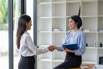 Businesswoman shaking hands during a meeting success, dealing, greeting and partner concept.