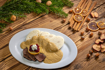 Traditional Christmas dinner in Czech Republic - sirloin in cream sauce
