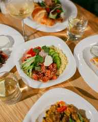 Healthy salmon bowl. Healthy food. Fresh bowl with avocado, salmon, couscouse, cucumber and cream cheese