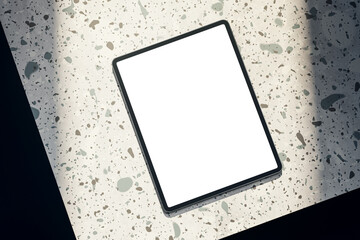 Top view of empty white tablet on spotted table. Mock up, 3D Rendering.