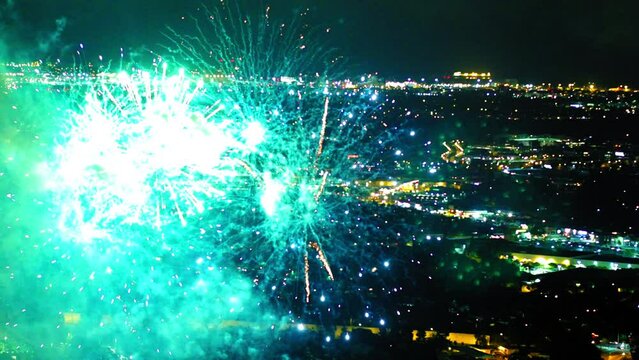 Aerial Shot Of Fireworks Sparkling In Illuminated City Against Clear Sky At Night - Culver City, California