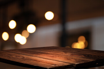 blurred background of bar and dark brown retro wooden table for product