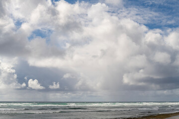 Beautiful white clouds above the Pacific Ocean in Kauai, Hawaii, United States.
