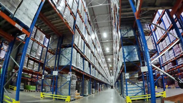 Workers work in the warehouse general plan time lapse. Large modern warehouse timelapse. Workflow in a large warehouse