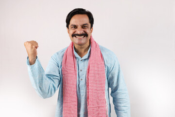 Happy rural Indian farmer standing in the white background, the passionate farmer full of...