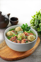 traditional chinese braised healthy herb pork meat ball main course in hot soup clay pot on grey vintage background cafe hotel luxury halal food restaurant banquet menu