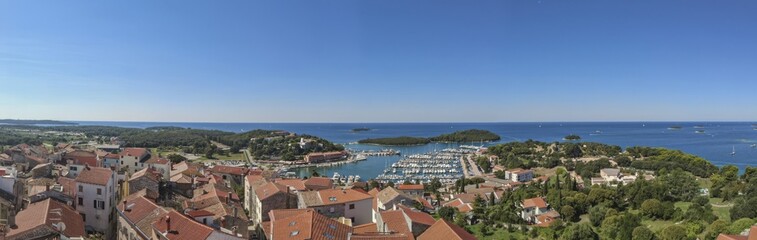 Fototapeta na wymiar Panoramic picture of the Croatian harbor town of Vrsar on the Limski Fjord from the church bell tower