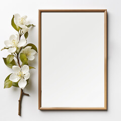 Mockup frame with blossom twig on white background, top view