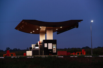 Modern self service gas station at night