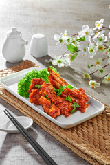 traditional chinese stir fried fat pork ribs roll spicy and sweet sauce meat main course in plate...