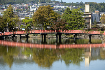 Fototapeta na wymiar Matsumoto castle with red bridge in spring 10 12 2023