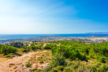 View of the landscape and the Mediterranean Sea from a mountain on the Greek island of Kos.	