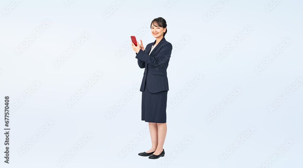Poster スマホを使うスーツを着た女性　切り抜き全身写真（切り抜き背景透過pngも販売しております。作成者リンクから「png」で検索してください）