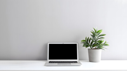 Fototapeta premium Laptop computer with blank screen on desk in modern home or office interior mock up