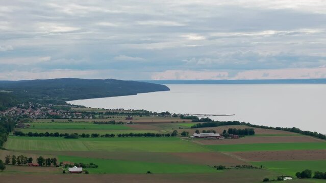 A View Of Lake Vattern With A Picturesque Little Swedish Village Near Brahehus Castle, Sweden. Aerial Drone Shot 