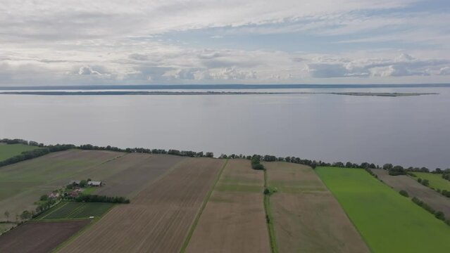Coastal Agricultural Fields Along Lake Vattern In Smaland, Sweden. Aerial Shot