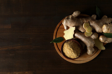 Fresh ginger root with ginger powder in a bowl