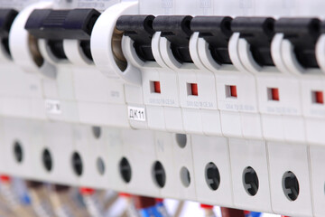 Included circuit breakers to protect electrical loads, close-up. Soft focus.