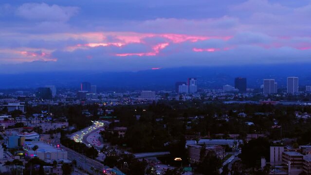 Aerial Panning Scenic View Of City Landscape Under Clouds During Dramatic Dusk - Culver City, California