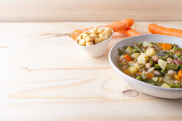 Vegetable and legume minestrone served with croutons. Complete vegan dish ideal for lunch and...