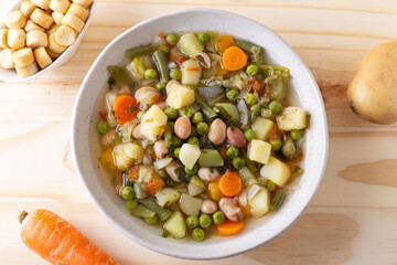 Vegetable and legume minestrone served with croutons. Complete vegan dish ideal for lunch and dinner. Italian minestrone.