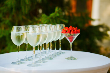 Strawberries in a glass as an appetizer for champagne at a banquet. 