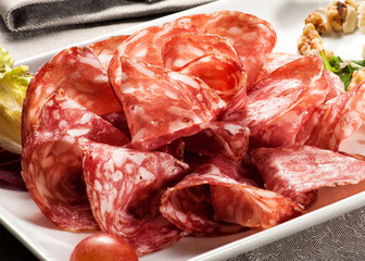 Salami slices on tray in restaurant