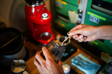 Japanese barista giving a class about how to make coffee