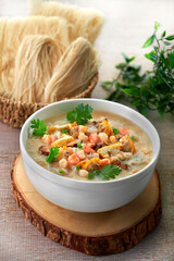 traditional chinese healthy braised puritan noodle with clam prawn seafood thick soup in bowl on grey vintage background cafe hotel luxury halal food restaurant banquet menu