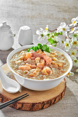 traditional chinese healthy braised puritan noodle with clam prawn seafood thick soup in bowl on grey vintage background cafe hotel luxury halal food restaurant banquet menu