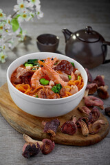 traditional chinese healthy braised puritan noodle with clam prawn seafood spicy tom yum thick soup in bowl on grey vintage background cafe hotel luxury halal food restaurant banquet menu