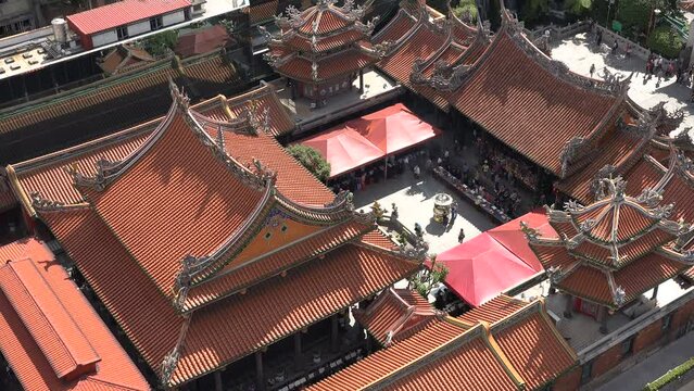 Overhead view of the imposing Longshan (Dragon Mountain) temple in Taipei, traditional Chinese rooftop design, Taiwan
