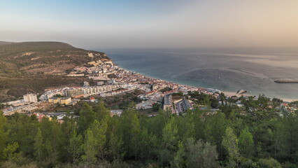 Obraz premium Aerial view of the coastline of the village of Sesimbra timelapse. Portugal