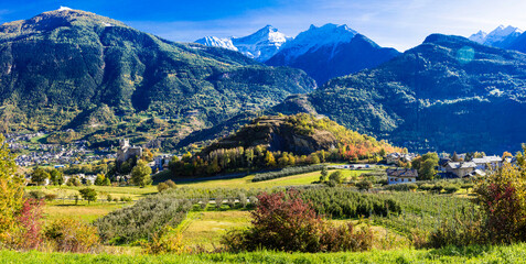 Fototapeta na wymiar Scenic nature Valley Aosta (Valle d'Aosta) in northern Italy. view of medieval castle Saint Pier surrounded bu impressive Alps mountains