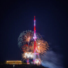 Explosion of multi-colored fireworks at Mtatsminda park against the night sky on celebrations holidays in Tbilisi, Georgia. High quality photo - 677596483