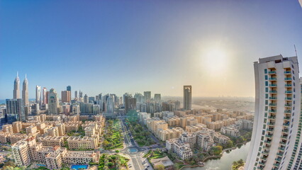 Sunrise over skyscrapers in Barsha Heights district and low rise buildings in Greens district...
