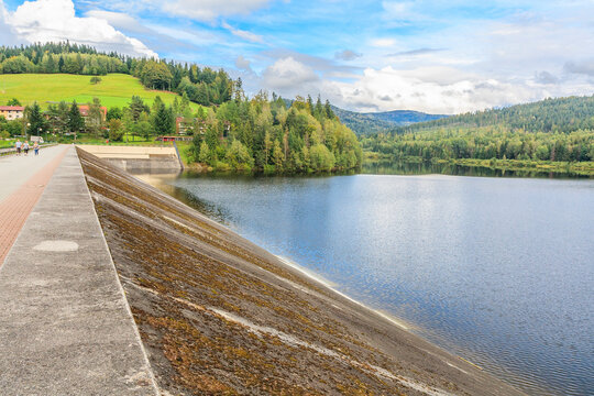 An earthen dam on the Vistula river forming Czerniańskie Lake in the Czarne district in the tourist town - Wisła in the Silesian Beskids (Poland).