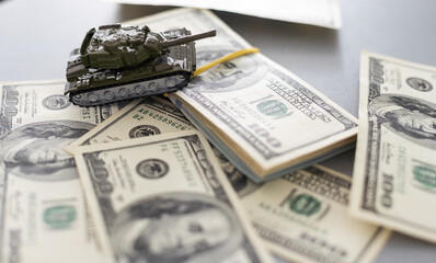 tank against the background of dollars. Concept of war.